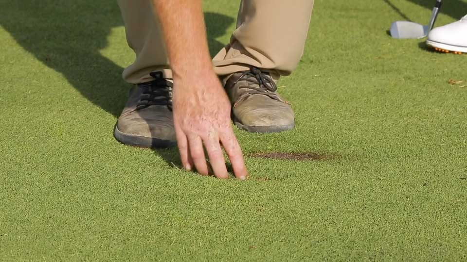 Replacing a divot on the fairway